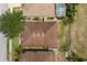 Aerial view of a house with a brown roof and a well-maintained lawn at 126 San Carlo Rd, Davenport, FL 33896
