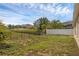 This backyard offers a fenced perimeter and a grassy area at 126 San Carlo Rd, Davenport, FL 33896