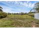 This backyard offers a large, well-maintained grassy area and fenced perimeter at 126 San Carlo Rd, Davenport, FL 33896