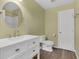 Bathroom featuring a white vanity, brushed gold hardware and new fixtures at 126 San Carlo Rd, Davenport, FL 33896