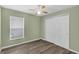 Bedroom featuring wood-look floors, ceiling fan and closet at 126 San Carlo Rd, Davenport, FL 33896