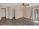 Spacious bedroom features modern ceiling fan, wood-look flooring and two closets at 126 San Carlo Rd, Davenport, FL 33896