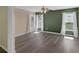 Spacious bedroom with two windows for natural light and gray wood-look flooring at 126 San Carlo Rd, Davenport, FL 33896
