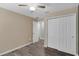 Bedroom with closet, ceiling fan, and wood-look floors at 126 San Carlo Rd, Davenport, FL 33896