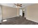 This spacious bedroom features a ceiling fan and a doorway to the en suite bathroom at 126 San Carlo Rd, Davenport, FL 33896