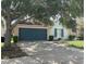 Charming one-story home featuring a two-car garage and beautiful exterior color scheme with lovely landscaping at 126 San Carlo Rd, Davenport, FL 33896