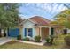 Inviting home with a well-manicured lawn, complemented by a side entry and touches of greenery enhancing its curb appeal at 126 San Carlo Rd, Davenport, FL 33896