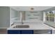 Modern kitchen island featuring a stainless steel sink and lots of counter space at 126 San Carlo Rd, Davenport, FL 33896