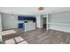 Open-concept kitchen featuring blue cabinets, stainless steel appliances, and a breakfast bar at 126 San Carlo Rd, Davenport, FL 33896