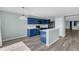 Kitchen featuring stylish blue cabinets, modern appliances, and ample countertop space at 126 San Carlo Rd, Davenport, FL 33896