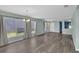 Inviting living area featuring modern flooring, large windows and a seamless flow into other living spaces at 126 San Carlo Rd, Davenport, FL 33896