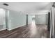 Open-concept living area features stylish laminate flooring and a fresh color palette, enhancing the bright, airy feel at 126 San Carlo Rd, Davenport, FL 33896