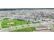 Overhead view of community with houses, lakes, playground, and green spaces at 13323 Panama Beach Ct, Orlando, FL 32827