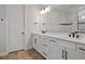 Elegant bathroom with double vanity, granite countertop, and tiled shower at 13323 Panama Beach Ct, Orlando, FL 32827