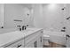 Modern bathroom featuring a quartz vanity top, and stylish marble shower at 13323 Panama Beach Ct, Orlando, FL 32827