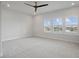 Light filled bedroom featuring plush carpet, neutral walls and multiple windows at 13323 Panama Beach Ct, Orlando, FL 32827