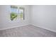 Neutral bedroom with a window at 13323 Panama Beach Ct, Orlando, FL 32827