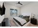 Comfortable bedroom with plush bedding, stylish side tables, and plantation shutters at 13323 Panama Beach Ct, Orlando, FL 32827