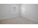 Neutral bedroom with a window and a closet at 13323 Panama Beach Ct, Orlando, FL 32827