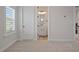 Bedroom with adjoining bathroom featuring a white vanity and mirror at 13323 Panama Beach Ct, Orlando, FL 32827