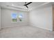 Bright, airy bedroom with plush carpeting, tray ceiling and large window with shutters at 13323 Panama Beach Ct, Orlando, FL 32827