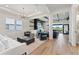 Open living room with recessed lighting, beamed ceilings, fireplace, and stylish furniture arrangement at 13323 Panama Beach Ct, Orlando, FL 32827