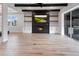 Spacious living room with dark wood beams, fireplace, and sliding door to outdoor grill and dining area at 13323 Panama Beach Ct, Orlando, FL 32827