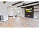 Spacious living room featuring tiled flooring, fireplace, wood beams, and modern décor at 13323 Panama Beach Ct, Orlando, FL 32827
