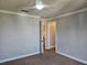 Bedroom featuring neutral walls, carpet flooring, and open doorway, creating a versatile space at 1414 Stickley Ave, Kissimmee, FL 34747