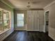 Dining room with hardwood floors, natural light, and built-in cabinets with a view of the exterior at 1414 Stickley Ave, Kissimmee, FL 34747
