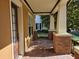 Inviting front porch with brick accents, offering a cozy outdoor space and architectural appeal at 1414 Stickley Ave, Kissimmee, FL 34747