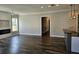 Spacious living room with modern fireplace, gray walls, and luxury vinyl plank flooring at 1414 Stickley Ave, Kissimmee, FL 34747