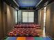 Entertainment room with colorful playmat and tiered seating, providing a versatile space for activities and relaxation at 1414 Stickley Ave, Kissimmee, FL 34747