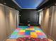 Entertainment room with colorful playmat, providing a versatile space for activities and relaxation at 1414 Stickley Ave, Kissimmee, FL 34747