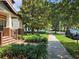 Charming street view with mature trees and landscaping, showcasing the neighborhood's appeal and community at 1414 Stickley Ave, Kissimmee, FL 34747