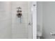 Contemporary bathroom featuring a walk-in shower with white tile and modern fixtures at 1418 Kissimmee Ct, Kissimmee, FL 34759