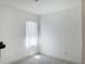This small room has wood floors and a small window at 1418 Kissimmee Ct, Kissimmee, FL 34759