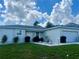 Charming single-story home with a well-manicured lawn and landscaped front yard at 1418 Kissimmee Ct, Kissimmee, FL 34759