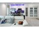 Open-concept living area flows into a modern kitchen with stainless steel appliances at 1418 Kissimmee Ct, Kissimmee, FL 34759