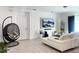 Contemporary living room with stylish furniture and a wall-mounted TV at 1418 Kissimmee Ct, Kissimmee, FL 34759
