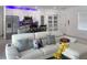 Bright living room next to modern kitchen featuring hardwood floors and a comfortable sofa at 1418 Kissimmee Ct, Kissimmee, FL 34759