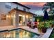 Inviting backyard area with a swimming pool, patio seating, and lush landscaping at 1420 Palmer Ave, Winter Park, FL 32789