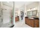 Bright bathroom features a tiled walk-in shower, double vanity, and a walk-in closet at 1420 Palmer Ave, Winter Park, FL 32789