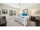 Bedroom featuring a Queen size bed, bedside tables, and a window with wooded view at 1420 Palmer Ave, Winter Park, FL 32789