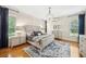 Serene bedroom featuring hardwood floors, plenty of natural light, and neutral tones at 1420 Palmer Ave, Winter Park, FL 32789