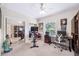 Bedroom with mirrored closet doors, workspace, and stationary bike for a home gym at 1420 Palmer Ave, Winter Park, FL 32789