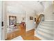 Spacious foyer featuring hardwood floors, staircase, and access to a sitting area, creating a grand entrance at 1420 Palmer Ave, Winter Park, FL 32789