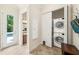 Laundry room with stacked washer and dryer, and access to the pool and bathroom at 1420 Palmer Ave, Winter Park, FL 32789