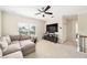 Upstairs living room with a comfortable sectional couch and large flat screen TV at 1420 Palmer Ave, Winter Park, FL 32789