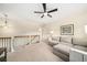 Upstairs living room with neutral colors, a couch, and a black iron stair rail at 1420 Palmer Ave, Winter Park, FL 32789